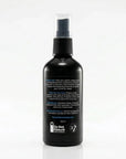 A black spray bottle with a clear cap and black spray nozzle, shown from the back on a white background. The back of the bottle features white text and a small white logo near the bottom.