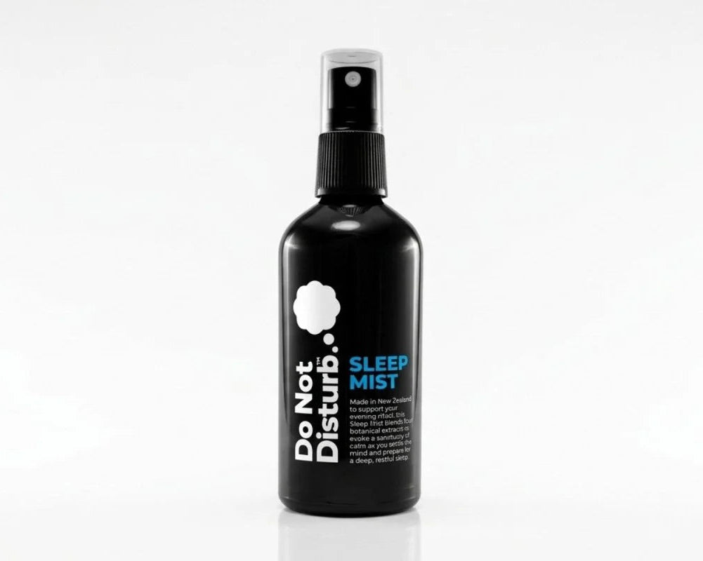 Black spray bottle labeled 'Do Not Disturb Sleep Mist' on a white background